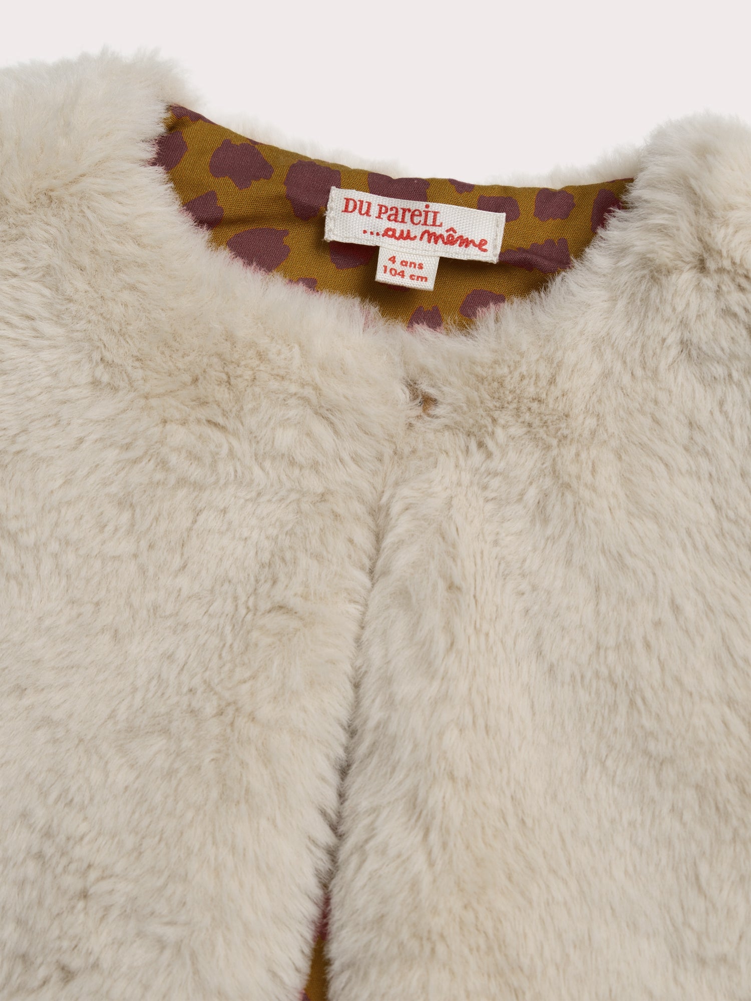 Gilet sans manche en fourrure synthétique réversible